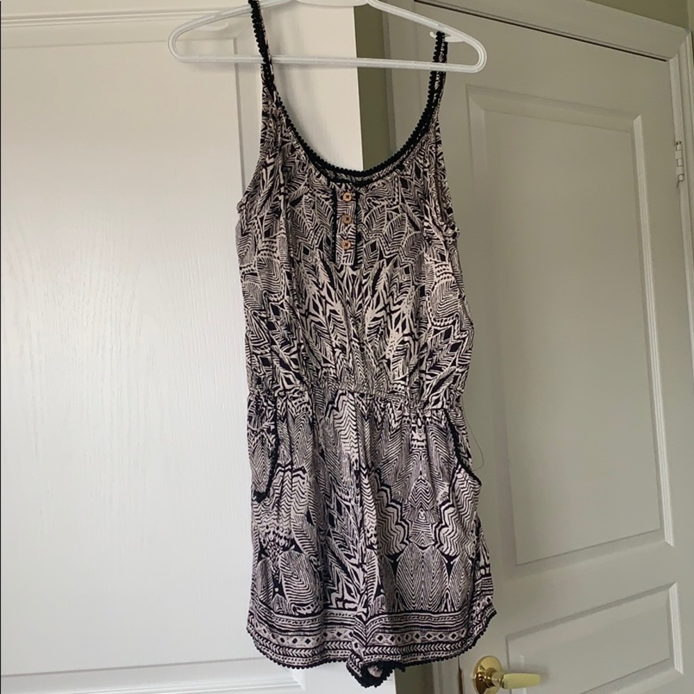 Black and white patterned romper with pockets